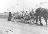 Thumbnail for 'Haddow, Robert (Bob) - 1910 (ca.) - Driving a cart with Betty Haddow and friends'