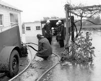 Thumbnail for 'Flood of 1963 - Civil Defense crew pumping basement'