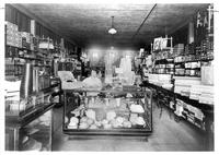 Thumbnail for 'Bjork's Department Store - 1923 (ca.) - Interior View of Store with Alice Willingham behind the counter'