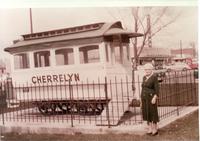 Thumbnail for 'Cherrelyn Horse Car with lady standing beside it at Englewood City Hall- 1957 - 3345 S Bannock'