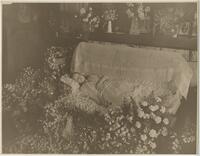Thumbnail for 'Deceased girl laying in coffin surrounded by flowers, Undated'