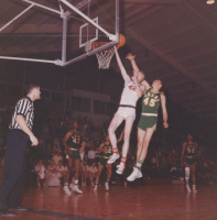 Thumbnail for 'An Adams State defender attempts to block a WSC layup, 1963.'
