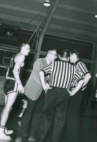 Thumbnail for 'WSC coach Gene Anderson discuss a point with the game's referees, 1963.'