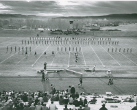 Thumbnail for 'WSC Marching Band at the halftime festivities, 1955 Homecoming, Mountaineer Bowl.'