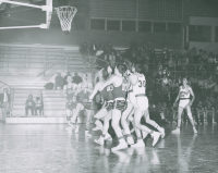 Thumbnail for 'WSC basketball action under the net vs. New Mexico Highlands, ca. mid-1950s.'