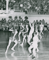 Thumbnail for 'A mid-1950s WSC pep band is on hand to support the Mountaineer basketball team in Mountaineer Gymnasium.'