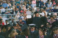 Thumbnail for 'A happy graduate at commencement exercises in Mountaineer Bowl, 1990s.'