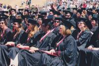 Thumbnail for 'With diplomas in hand, the Class of 2004 waits for Commencement ceremonies to conclude.'