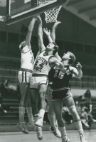Thumbnail for 'Brian Kiefer ('80-'83) attempts a shot under the basket in Wright Gymnasium, ca. 1983.'