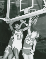 Thumbnail for 'Western State's Benny Wright is tangled with defenders from Kansas Highlands (?) ca. 1983.'