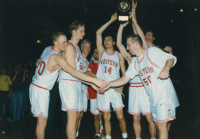 Thumbnail for 'The new RMAC basketball champions show off their trophy and congratulate each other after their win over Mesa State, March 1993.'