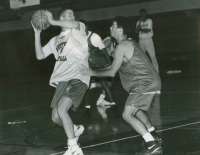 Thumbnail for 'Coach Jay Helman watches basketball practice in Wright Gymnasium, ca. 1993.'