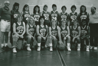 Thumbnail for 'Assistant coach Gene Anderson (left) and head coach Jim Hahn pose with the 1989 women's basketball team for their yearbook...'