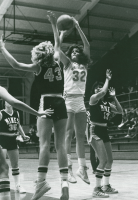 Thumbnail for 'A Mountaineer attempts a jump shot against a swarm of CSM Orediggers in women's basketball action, Wright Gymnasium'