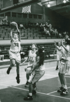 Thumbnail for 'Ft. Lewis College puts up little defense against WSC's layup in women's basketball action, Wright Gymnasium, ca. early 1990s.'