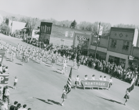 Thumbnail for 'Montrose High School marching band makes its way up Main Street during the 1956 WSC Band Day.'