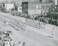 Thumbnail for 'The Norwood High School marching band marches up Gunnison's Main Street during the 1956 Band Day event.'