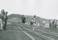 Thumbnail for 'WSC runner Duraine Richards crosses the finish line ahead of his School of Mines competitor in Mountaineer Bowl, ca. 1959.'