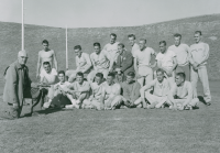 Thumbnail for 'The 1957-58 WSC track and field team pose for a photograph with their coaches Paul Wright and Sven Wiik in Mountaineer Bowl.'