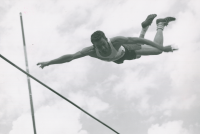Thumbnail for 'WSC track and field champion Bob Hansen flies over the bar in the pole vault competition, ca. 1959.'