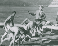 Thumbnail for 'Coach Paul Wright has fired the starting pistol at WSC track and field practice, ca. 1957.'