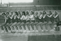 Thumbnail for 'A 1990s Western Volleyball team strike an interesting pose for a team photograph in Wright Gymnasium.'