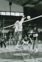 Thumbnail for 'Two WSC volleyball team members block a shot in Wright Gymnasium action, 1985.'