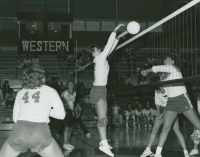 Thumbnail for 'WSC blocks a shot in women's volleyball action, Wright Gymnasium, 1985.'
