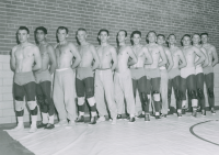 Thumbnail for 'The 1958 WSC wrestling team pose for a photograph in their practice togs.'