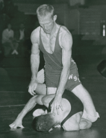 Thumbnail for 'Mountaineer wrestler Bob Holingshead seems to be in command in wrestling action, ca. 1961.'