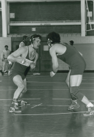 Thumbnail for 'A Mountaineer gets set to take down his opponent in Wright Gymnasium wrestling action, ca. 1986.'