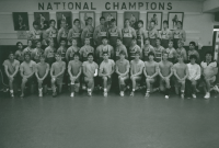 Thumbnail for 'Coach Greg Waggoner poses for a photograph with his wrestling team in Wright Gymnasium, ca. 1987.'