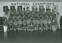 Thumbnail for 'Head coach Greg Waggoner and his 1993 WSC wrestling team pose for a team photograph in Wright Gymnasium.'