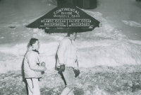 Thumbnail for 'Two WSC Hiking and Outing Club members at the Continental Divide atop Monarch Pass, circa winter 1963.'