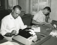 Thumbnail for 'Two WSC students concentrate on mastering the ten-key machine in Taylor Hall, 1959.'