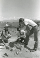 Thumbnail for 'Dr. Mark Stiger and two students examine an ancient firepit atop Tenderfoot (