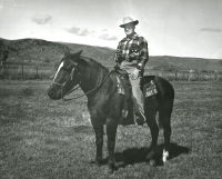 Thumbnail for 'President Peter Mickelson on horseback in the Castle Mountain Ranch area, ca. 1960.'
