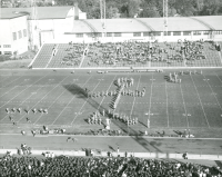 Thumbnail for 'WSC Mountaineer Marching Band performing at the University of Denver stadium, ca. 1956.'