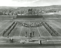 Thumbnail for 'WSC Mountaineer Marching Band in formation, Mountaineer Bowl, ca. 1968.'