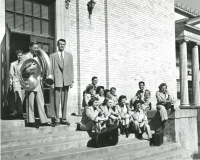 Thumbnail for 'Part of the WSC Mountaineer Band wait on the steps of Florence High School, probably waiting to perform during the Canon City...'