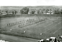 Thumbnail for 'Mountaineer Marching Band in entrance formation, Mountaineer Bowl, ca. 1956.'