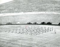 Thumbnail for 'The Mountaineer Marching Band performs for the Homecoming crowd in Mountaineer Bowl, ca. 1952.'