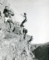 Thumbnail for 'Hiking and Outing Club members rappelling at Spring Creek, late 1940s.'