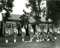 Thumbnail for 'Twirlers and Majorettes pose in front of Crawford Hall'