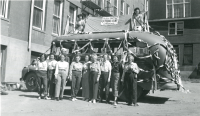Thumbnail for 'Hiking and Outing Club members pose with the decorated Outing bus on the southeast side of Taylor Hall, 1945.'