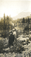 Thumbnail for 'John Keating (?) and two women explore the mountainous countryside, circa 1922.'