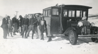 Thumbnail for 'Hiking and Outing Club members outside their buses on a snowy road, circa early 1930s.'