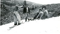 Thumbnail for 'Hiking and Outing Club members enjoy some spring skiing and tobogganing, 1930s.'