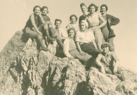 Thumbnail for 'Western hikers pause for a photograph on a rocky crest, circa 1938.'