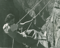 Thumbnail for 'A closeup of a rock climbing Western coed, circa late 1930s.'